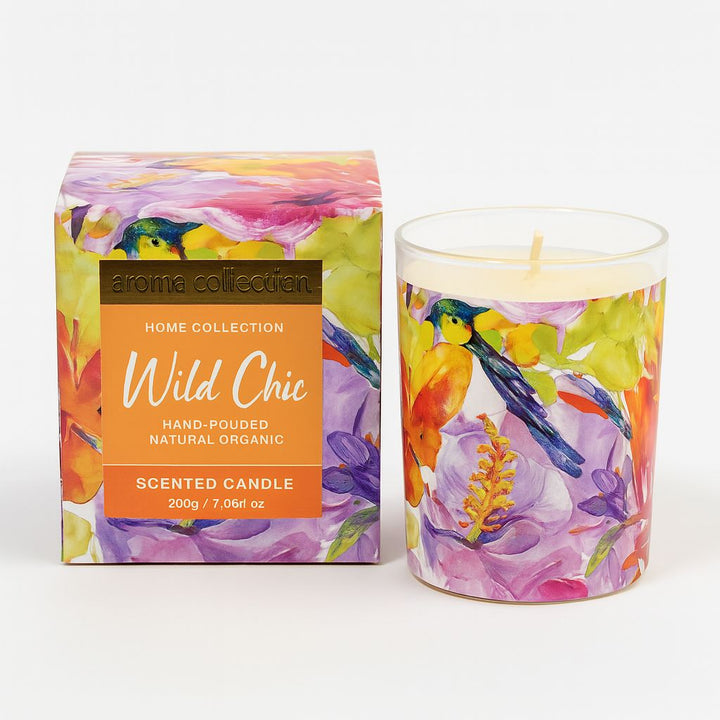 Scented candle with floral design next to its packaging on a white background