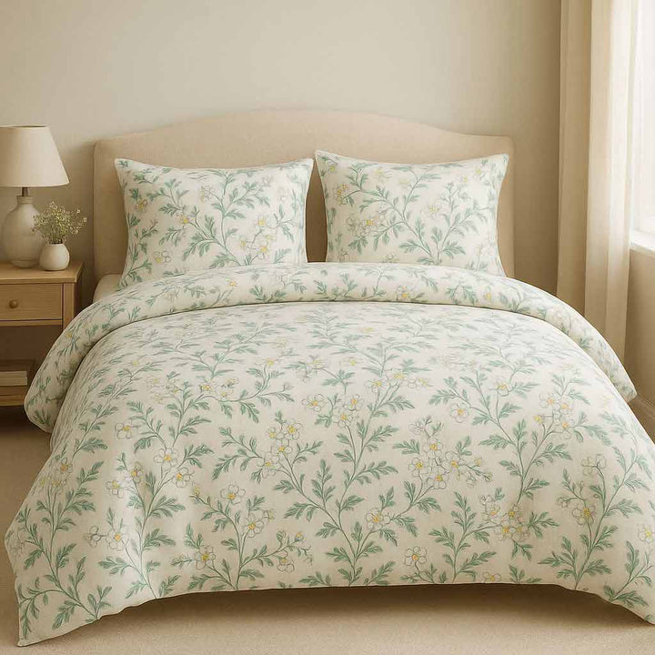 Floral patterned bedding set on a bed in a bedroom setting.
