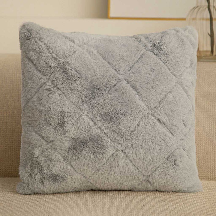 Gray textured pillow on a beige couch