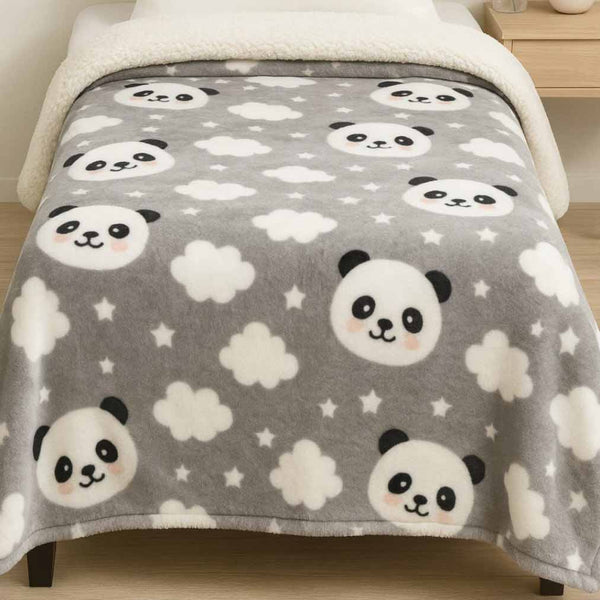 Gray winter blanket with panda faces and white clouds on a bed.