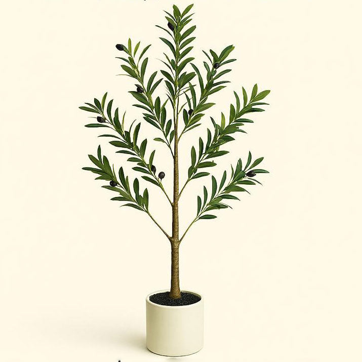 Potted artificial plant with green leaves on a beige background