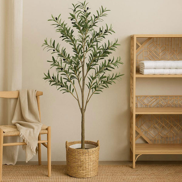 Artificial potted plant in a room with a wooden chair and shelf.