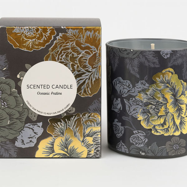 Floral-patterned scented candle and packaging on a white background