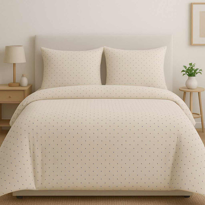 Beige patterned duvet cover set on a bed in a bedroom setting.
