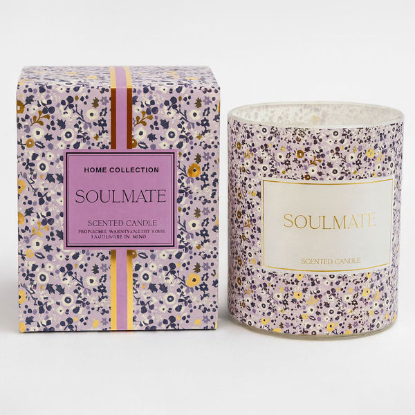 Scented candle with floral packaging labeled 'Soulmate' on a white background