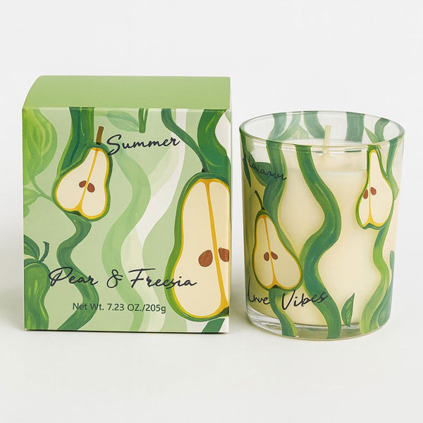 Candle with pear design and packaging on a white background