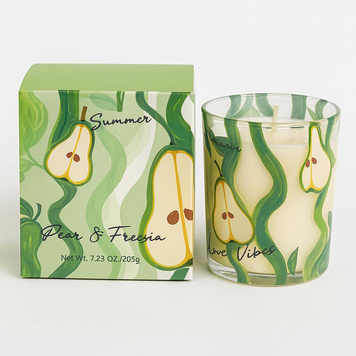 Candle with pear design and packaging on a white background