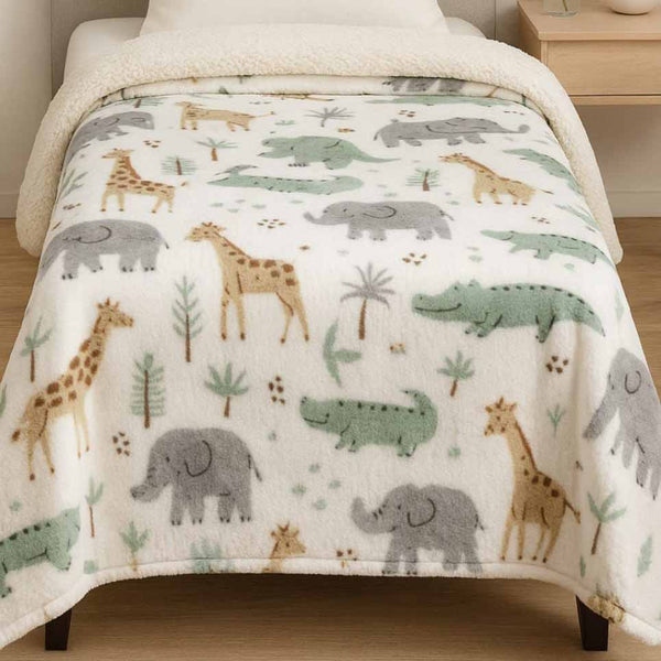 Children's winter blanket with animal pattern on a bed
