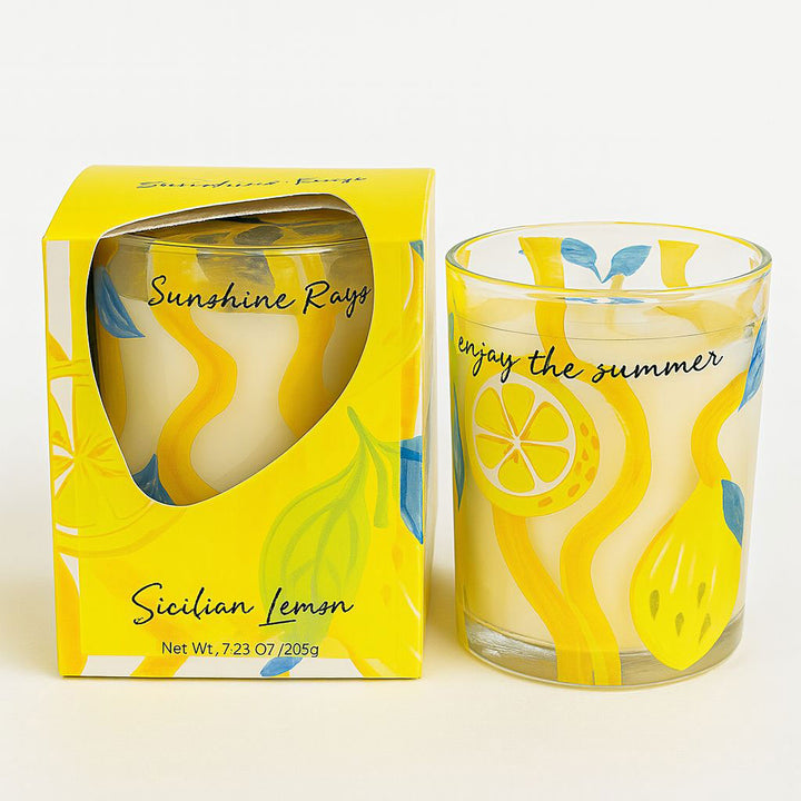 Scented candle with lemon design and packaging on a white background