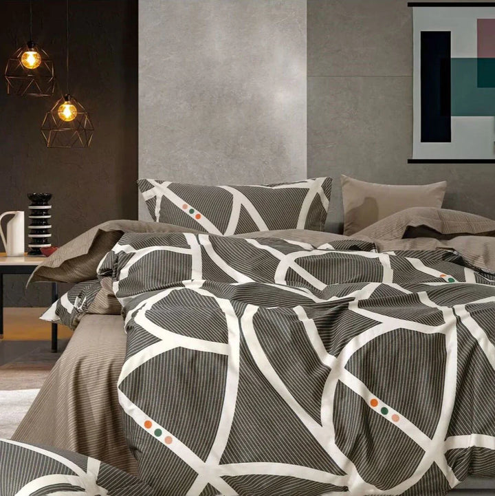 Bedroom with geometric patterned bedding set and modern decor