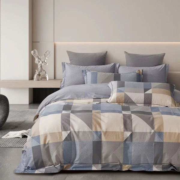 Geometric patterned bedding set on a bed in a modern bedroom.