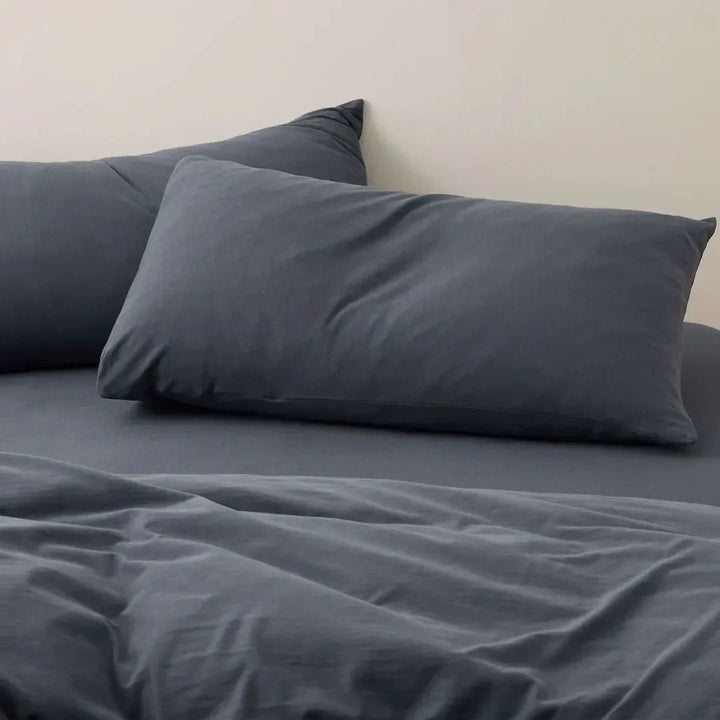 Close-up of dark gray plain cotton duvet cover set – calm, muted tone with subtle texture for modern spring bedding