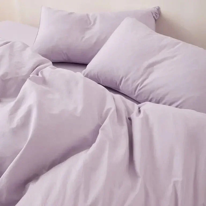Close-up of lilac plain cotton duvet cover set – vibrant, modern color with breathable cotton texture for seasonal bedding