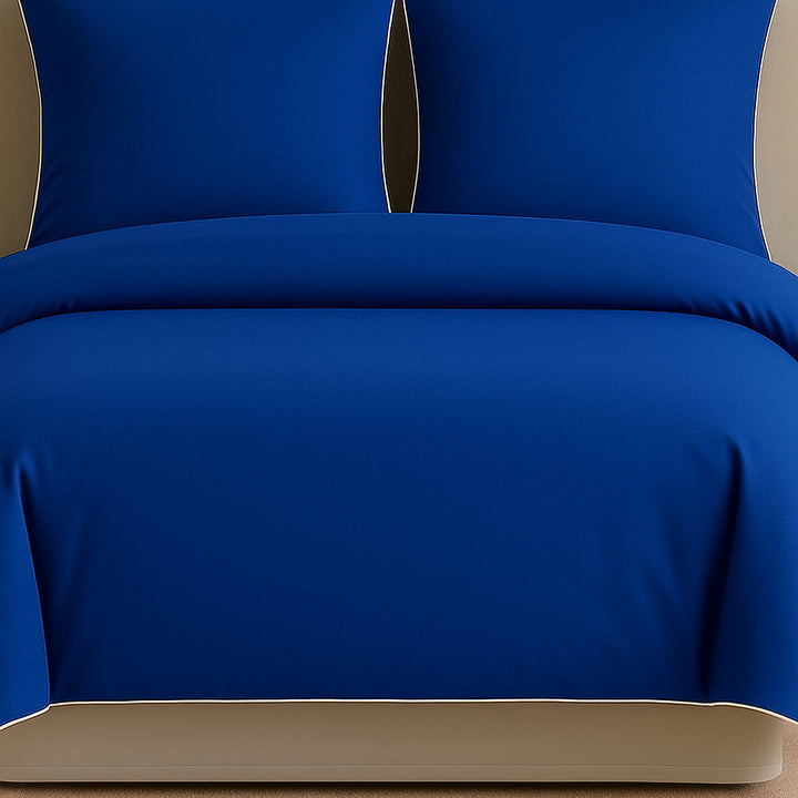 Blue bedding set on a bed in a bedroom setting