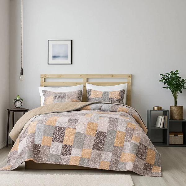 Bedroom with a wooden bed frame and patchwork bedspread set, nightstands with decor items.