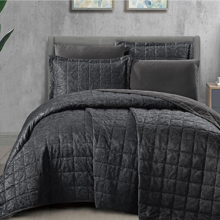 Summer black bridal bedspread set with a quilted fleur-des-lis pattern, styled on a king size bed