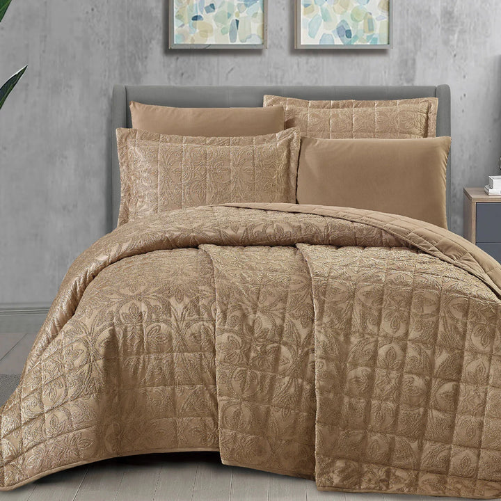 Summer brown bridal bedspread set with a quilted fleur-des-lis pattern, styled on a king size bed