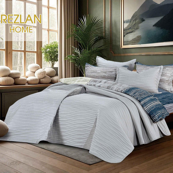 Summer light gray bedspread set with quilted wavy lines pattern, styled on a made bed