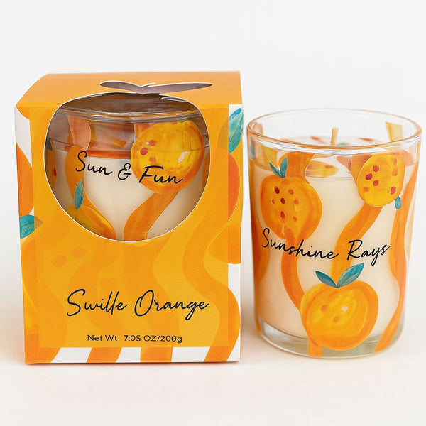 Orange-themed candle with packaging on a white background