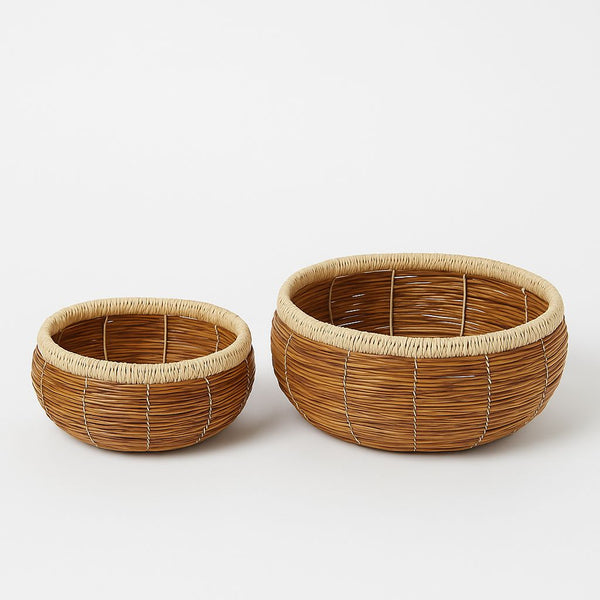 Two woven baskets on a white background