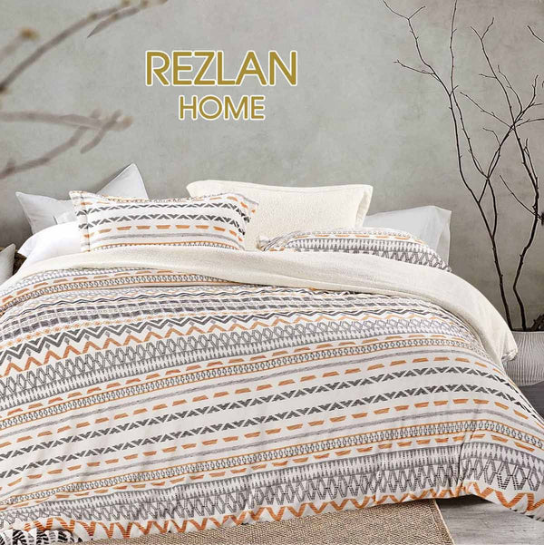 Bed with patterned bedding and 'REZLAN HOME' branding.