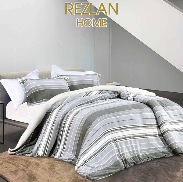 Bed with striped bedding and pillows, featuring REZLAN HOME branding.