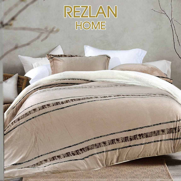 Beige and brown striped comforter on a bed with 'Rezlan Home' branding.
