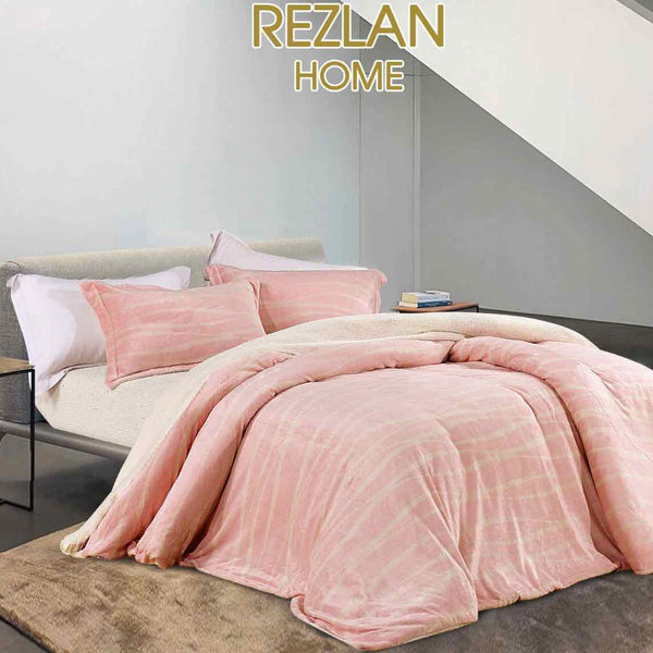 Pink bedding set on a bed with 'Rezlan Home' branding.